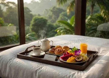 Room-service breakfast tray with tea, pastries and fresh fruit